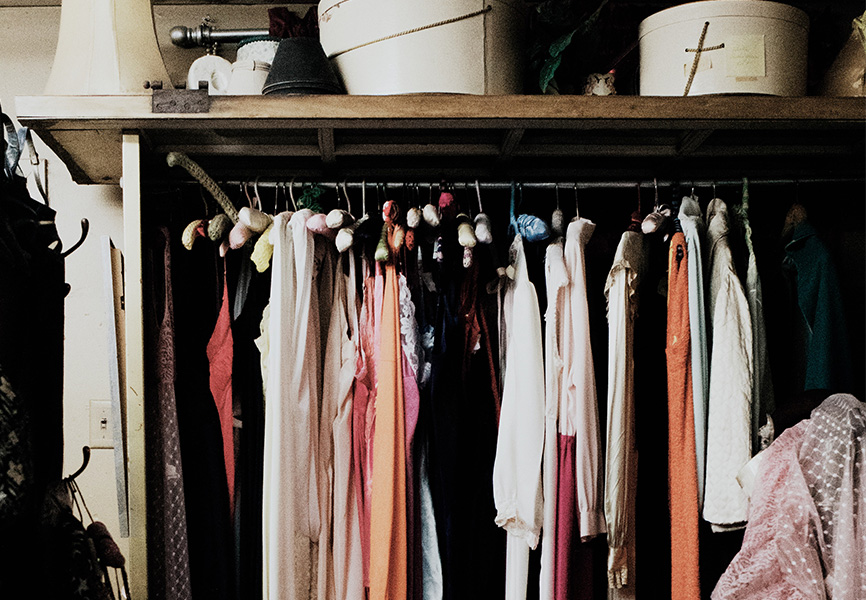 Messy closet full of clothings